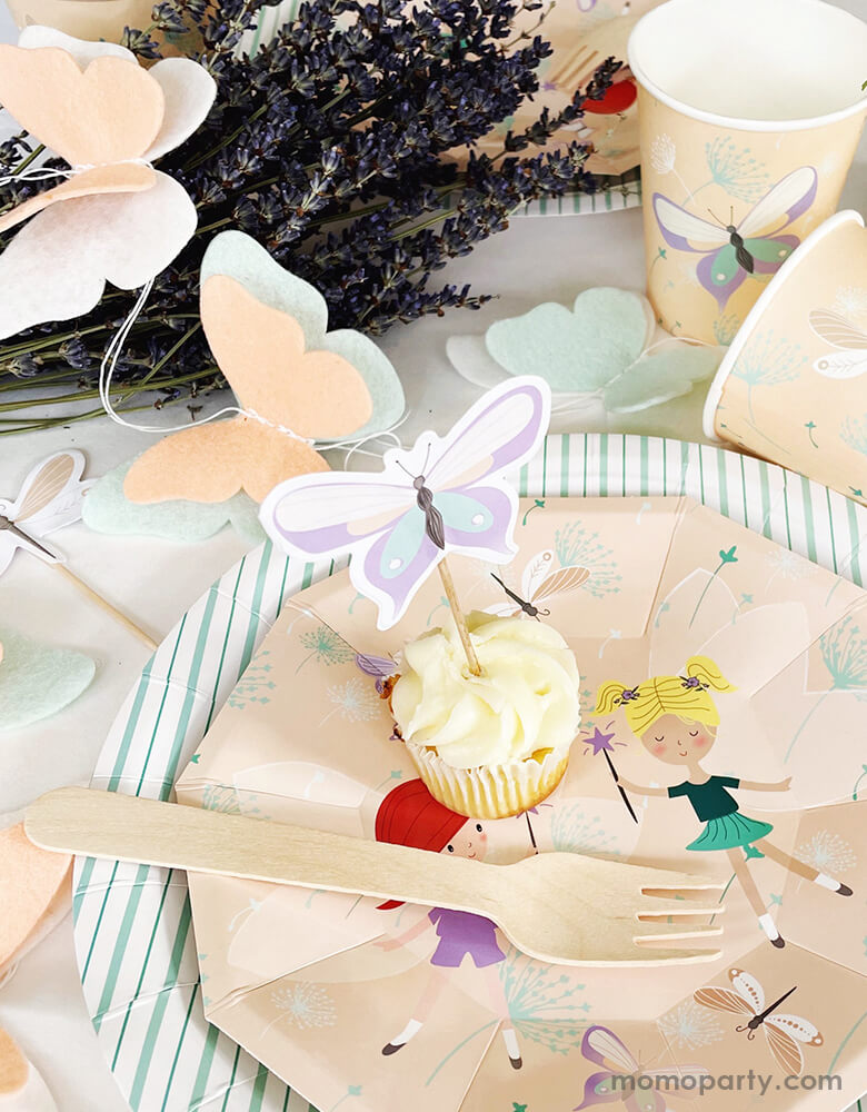 close up look of Fairy butterfly party table with cupcake on top of Magical Fairies Small Plates, layered with Mint Fine Stripes Plates, Magical Fairies Cups and handmade Pooka Party Butterfly Felt Garland around it, this butterfly garland featuring a felt garland with peach, mint and white butterflies. This Magical Fairies party collection is perfect for Girl's birthday party, Fairies party, butterfly themed party.