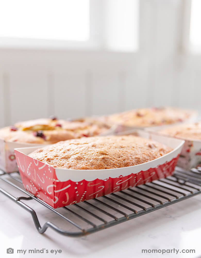 Holiday treats in the kitchen of baking bread in the My Mind's Eye - CANDY CANE LOAF PAN on the rack. this Paper loaf pans are constructed with high quality baking paper with candy cane graphic with red and white colors.. These mini loaf pan are perfect for baking bread or small cakes. Great for baking homemade gifts for friends and family, the holidays, or hostess gifts for dinner parties. Our disposable loaf pans are easy to dress up for gifting with the included plastic bag, tag and twine.