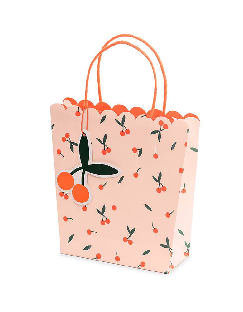 Party Deco 9" cherry gift bag in pink with cherry pattern design and and a die-cut cherry shaped tag on the side, perfect for birthday goodie bags or gifting 