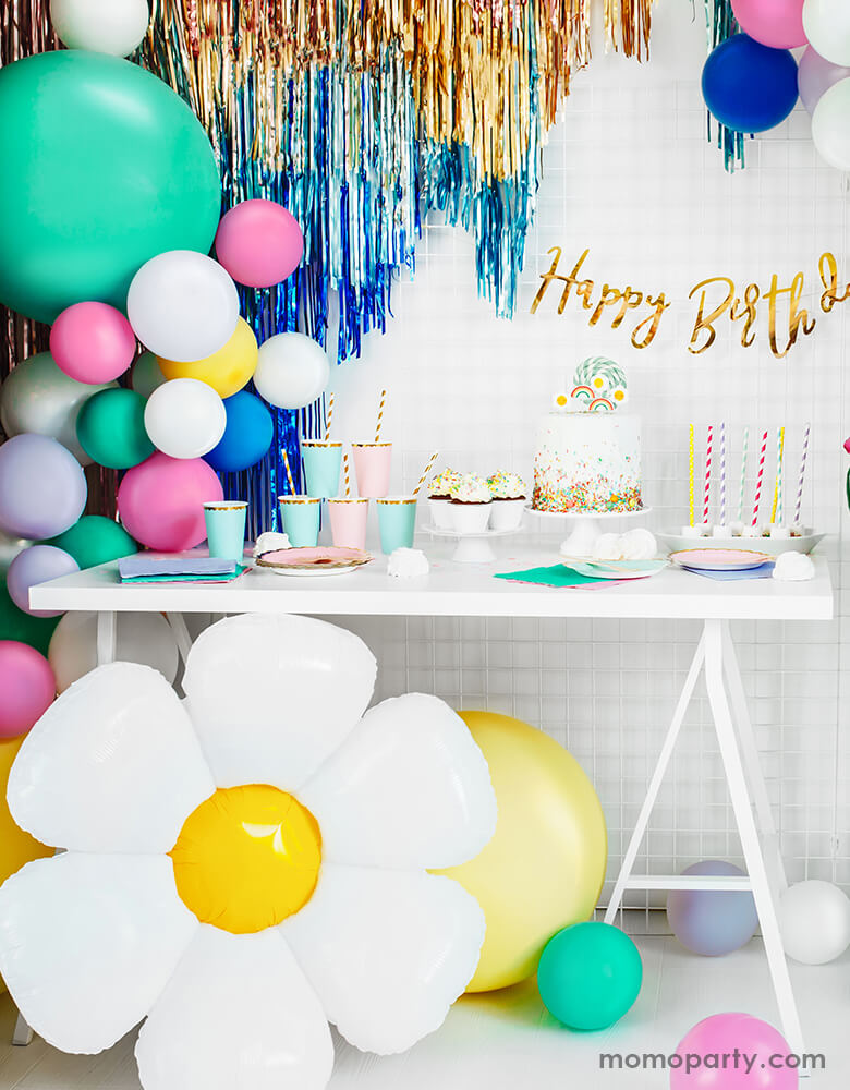 Birthday Party with Party Deco Daisy Foil Mylar Balloon, colorful latex balloons and gold, blue fringe decorated around a birthday party dessert table. Party look for a spring or tea party themed celebration, girls birthday Party