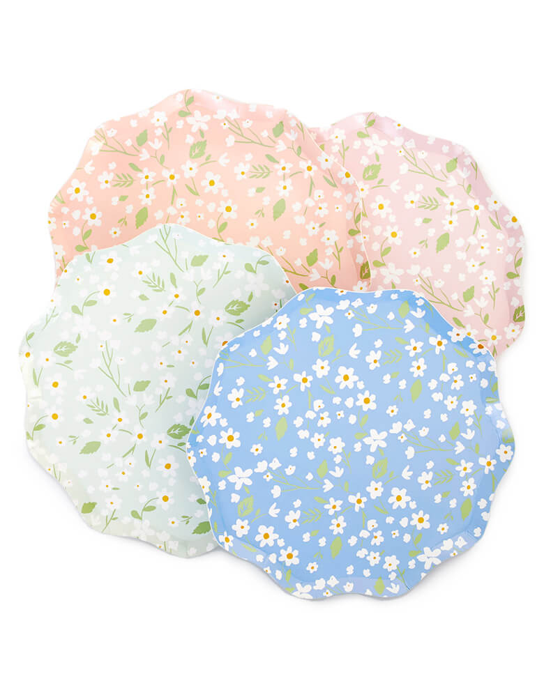 Ditsy Floral Dinner Plates By Meri Meri. Features a fabulous floral pattern with a stylish scalloped edged paper plates.  Pack of 12 in 4 colors: blue, green, pink and peach. Made from eco-friendly paper.  Add a touch of springtime beauty to your party table with these high quality, well designed party plates.