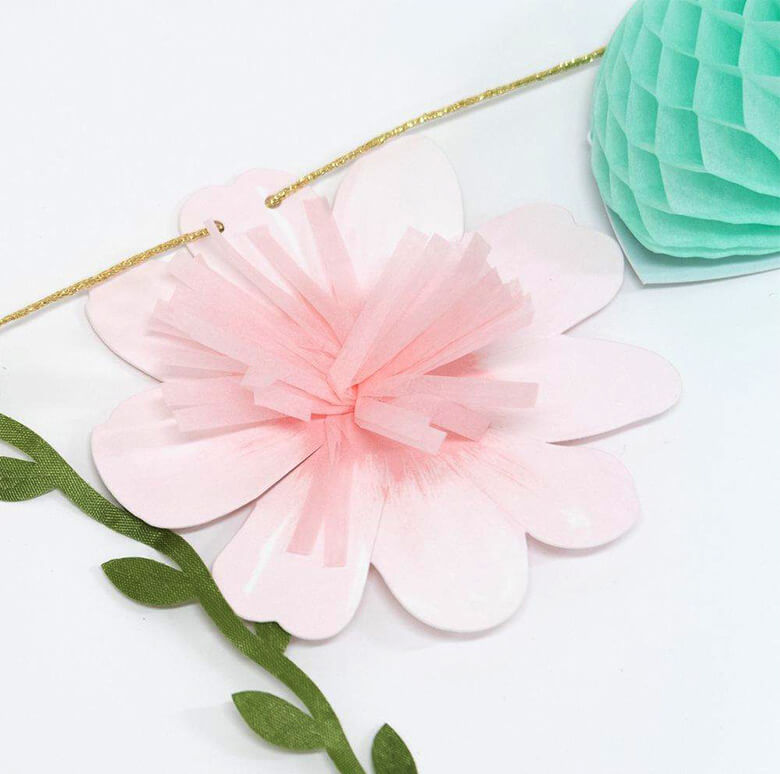 Details of Meri Meri Fairy Garland of The a pink flower made by sweet tissue paper tassels