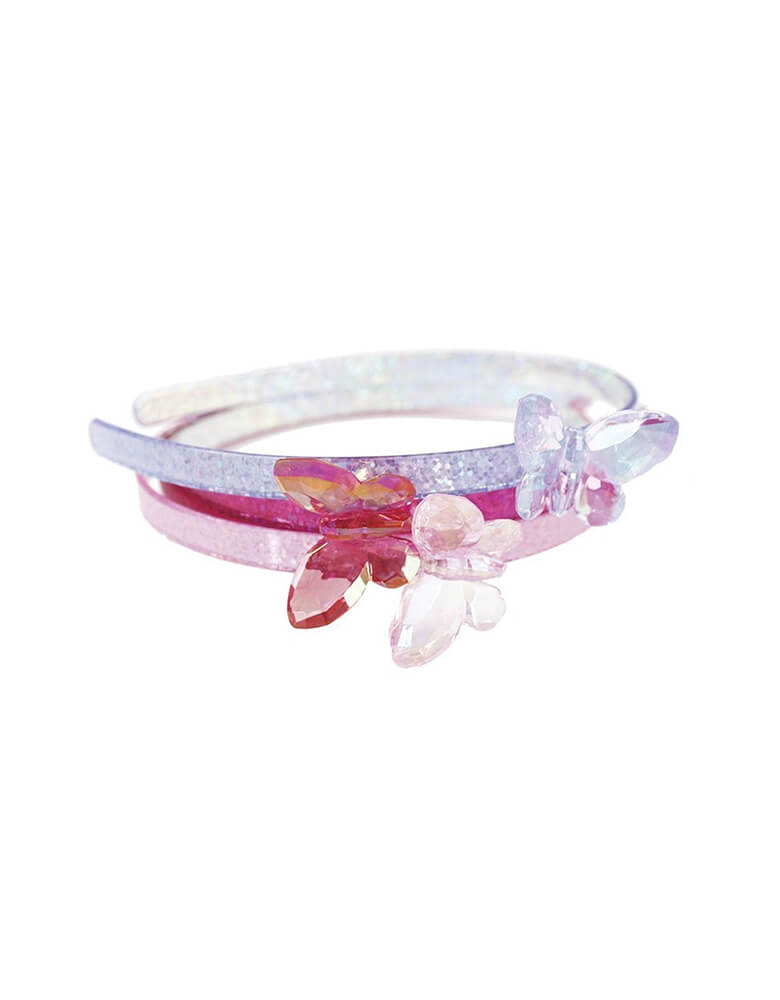 Fancy Flutter Butterfly Headband by Great Pretenders in pink, dark pink or violet. These crystal butterfly headbands are so attractive they'll give you the flutters! Each butterfly is iridescently clear and crystal-cut, resting in top of a colour-matched headband. The headband itself has a coating of holographic glam to give it an extra shiny look.