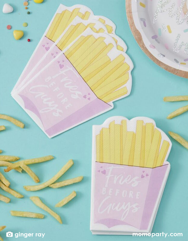 Fries and plates with Ginger Ray - Fries Before Guys Napkins on the table. This fun set of napkins will have everyone talking and the bright pink colors will not be missed. They're perfect for a Galentine's Day gathering!
