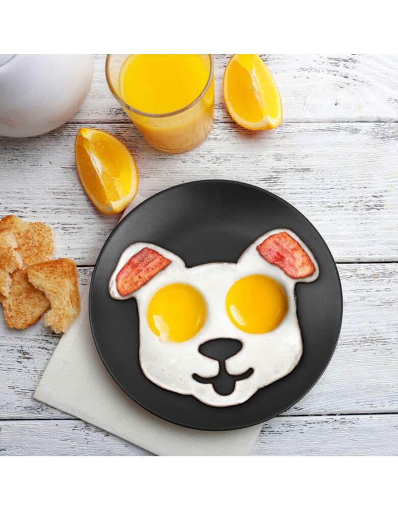 Genuine Fred Funny-Side-Up-Dog-Egg-Mold on a breakfast table