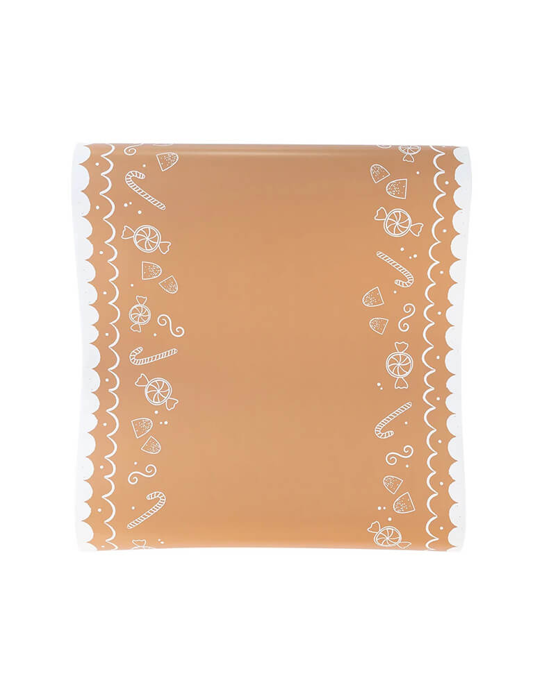Momo Party's 16" x 120" Gingerbread Table Runner by My Mind's Eye. Featuring white frosted candy icons that look good enough to eat, this table runner is the perfect addition to any Holiday table that needs a touch of whimsy.