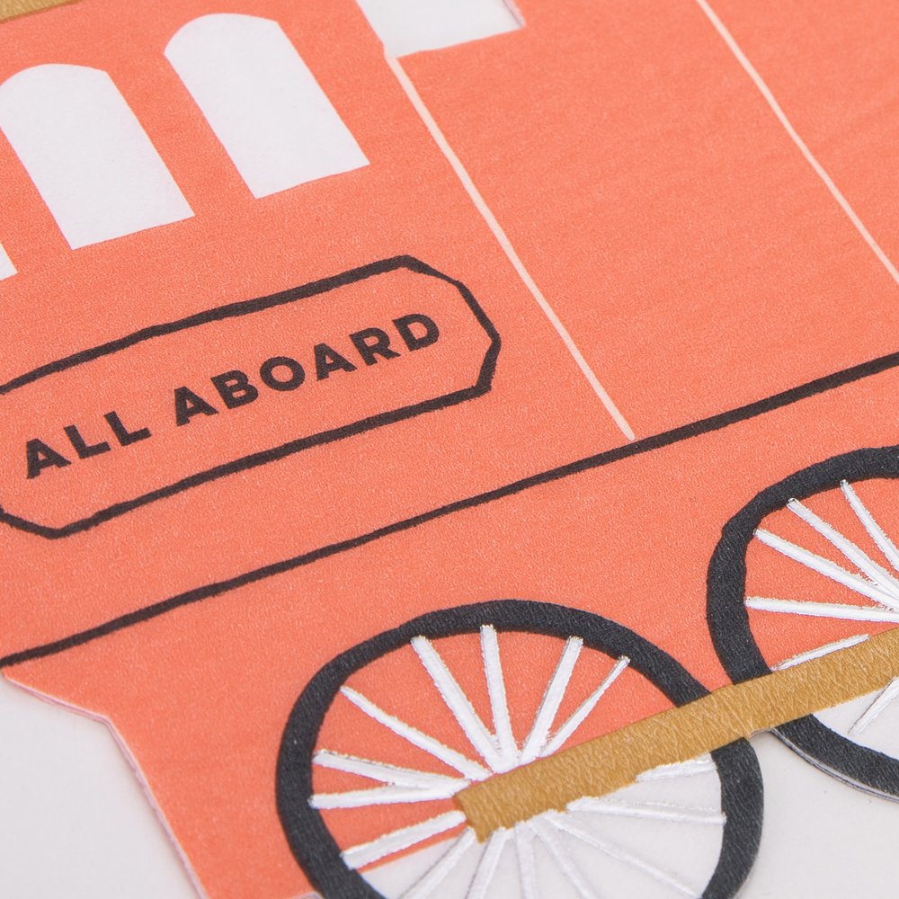A close up of Meri Meri's red train shaped napkin, crafted in 3-ply paper with silver foil in a vintage train design and look with "ALL ABOARD" written on the side, perfect for kid's train themed celebration or a chugga chugga two two themed 2nd birthday party.