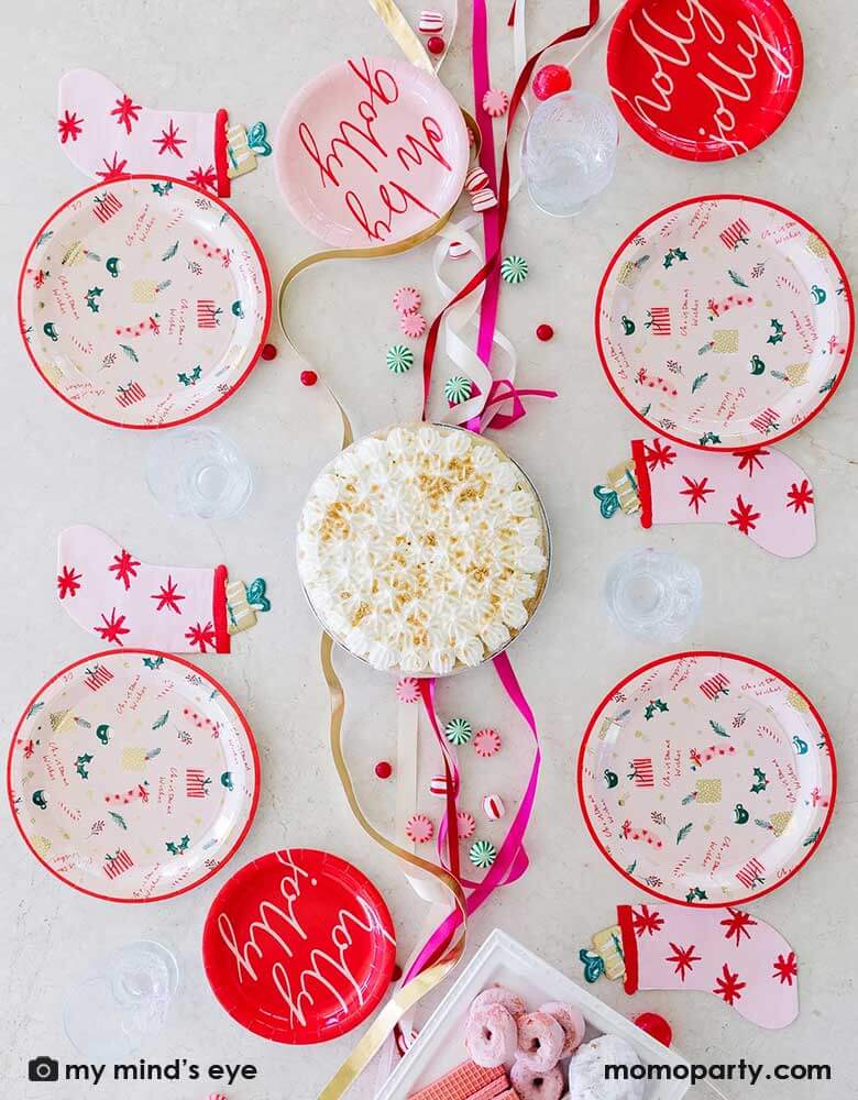 Set a pretty holiday party table with My Minds Eye’s pink stocking napkins with charming colors and art!Cute die cut stocking shape is soft and whimsical and a beautiful table piece. Modern pink colored napkin has red starbursts, stuffed toy with gold foil accents and a green bow! 18 napkins sized 4.5 x 6.5 inches pair beautifully with Christmas wishes, holly jolly and oh by golly plates at momoparty.com. Add peppermint twists, kisses, candycane, hot cocoa marshmallows and desserts for a cozy holiday table.