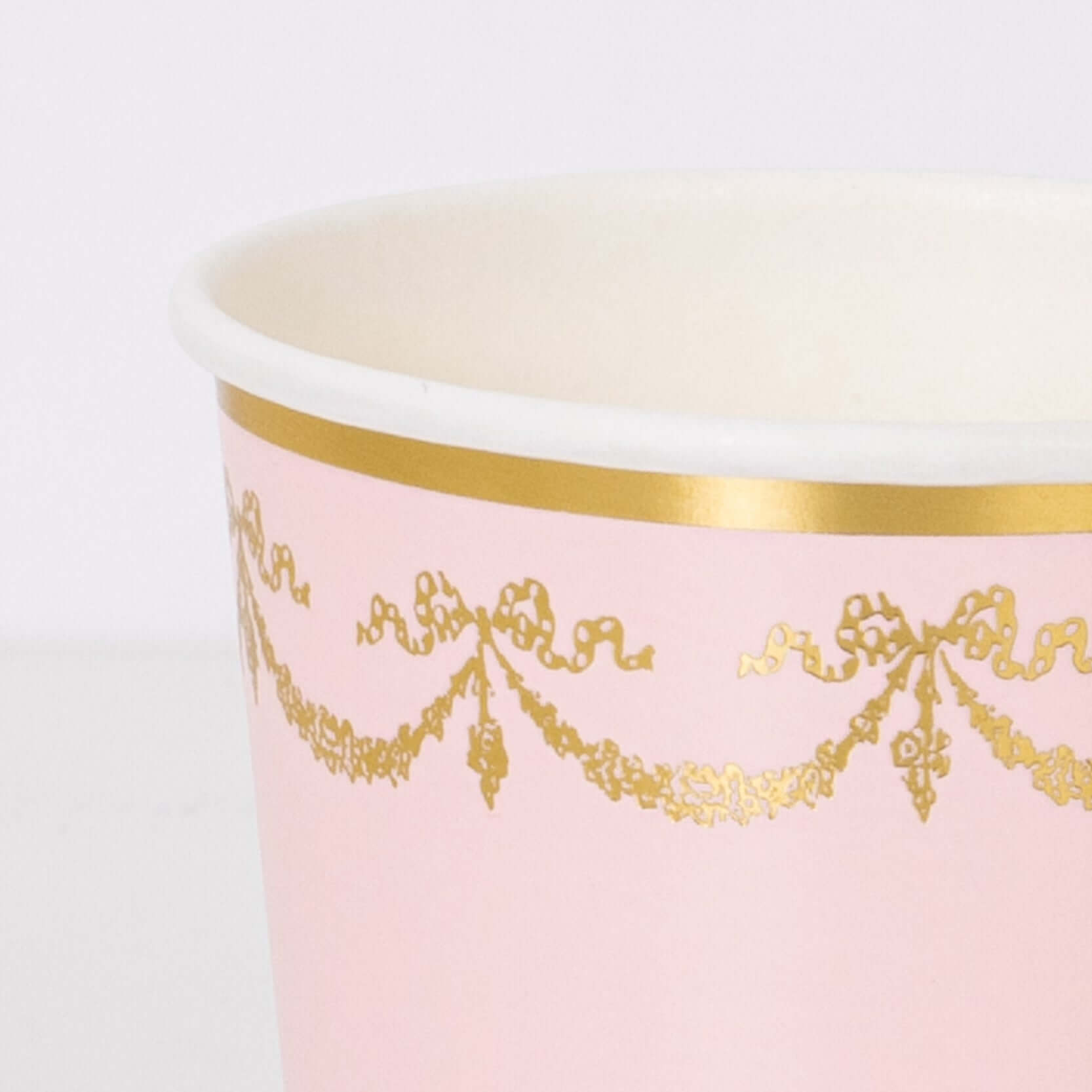 Details look of Ladurée Paris Cups by Meri Meri collaboration with Laduree, the restaurant, tea room and macaron specialist. Each set includes a blue, cream, pale pink, pale purple, mint, pale blue, pink and pale mint cup, with exquisite colors, gold foil design and borders. Perfect for Ladurée lovers, afternoon tea party, mother's day celebration, girls party and any fancy celebration