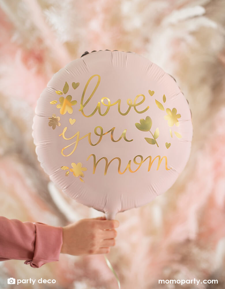 Momo Party's 18" round blush balloon by Party Deco with a message of "love you mom" in floral designs. It sets a great scene for a special Mother's Day celebration.