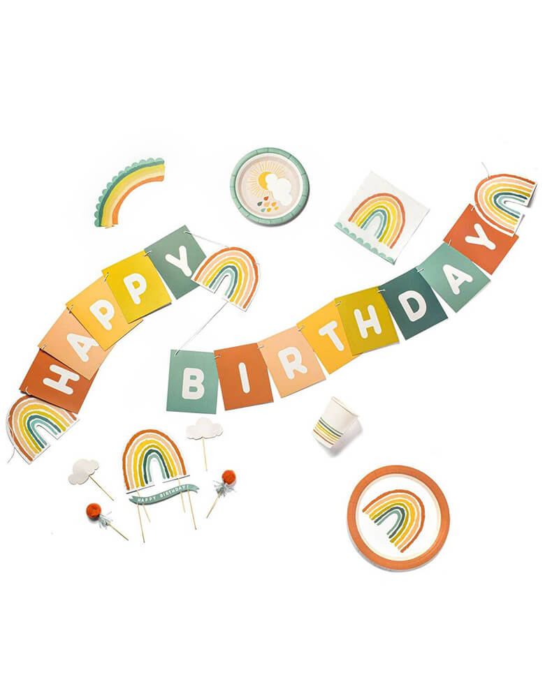 Lucy Darling Little-Rainbow-Party-in-a-Box_items including party dinner plates, dessert plates, cake topers, cupcake wrappers, party cups, and party banners in a flat lay shot
