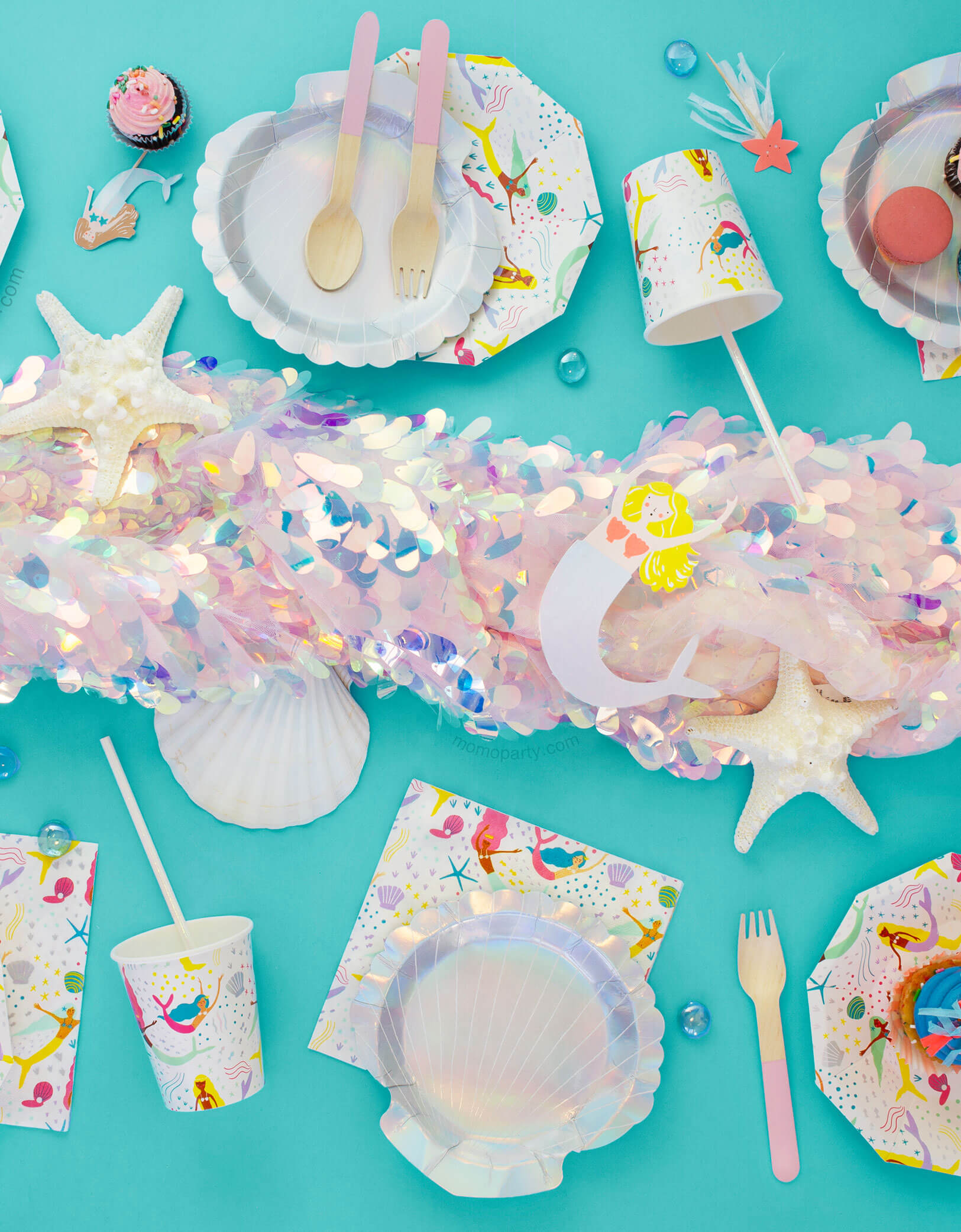 Mermaid Party Table set up inspiring with Small Shell holographic Plates, Mermaid cups, napkins, pink wooden utinsils 