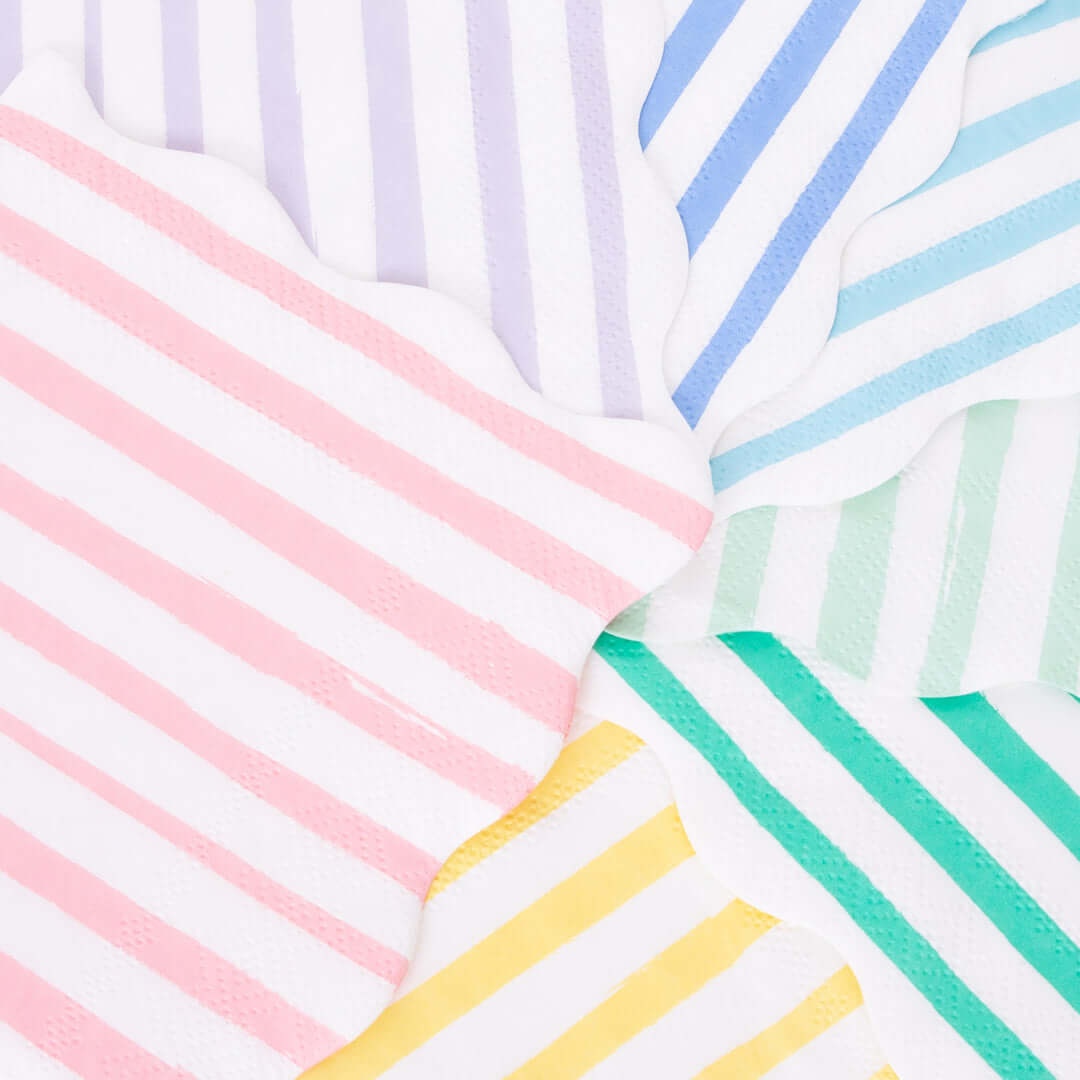 A detail look of Mixed Stripe Large Napkins by Meri Meri. Pack of 16 in 8 colors Made from eco-friendly paper. These wonderful large napkins feature 8 different stripes of color, and scalloped edges. These modern party napkins will add lots of color and style to any party table