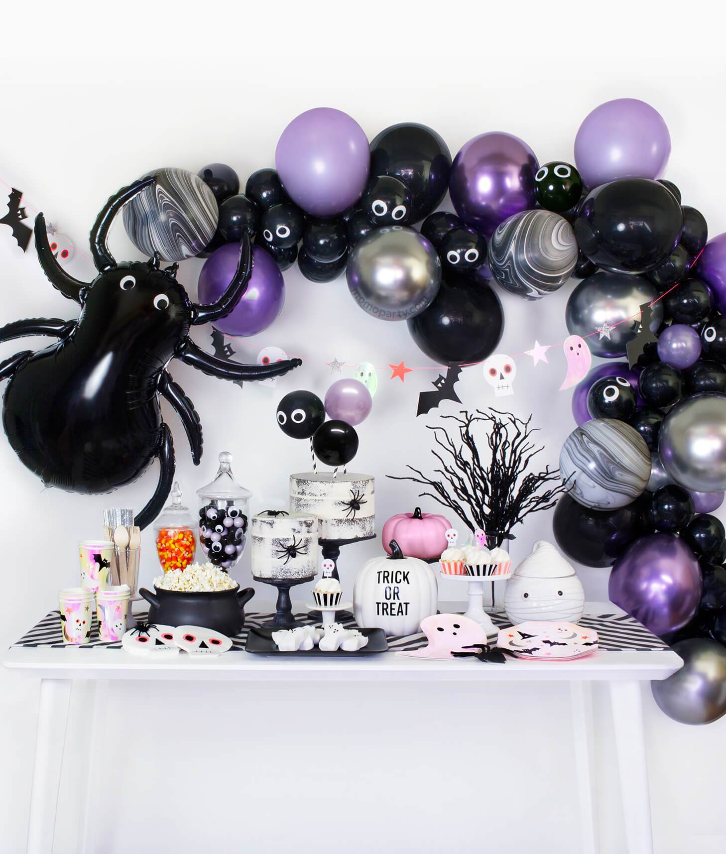 Momo Party Halloween party collection table set up with black, purple chrome and silver color balloon garland, black spider foil balloon decoration