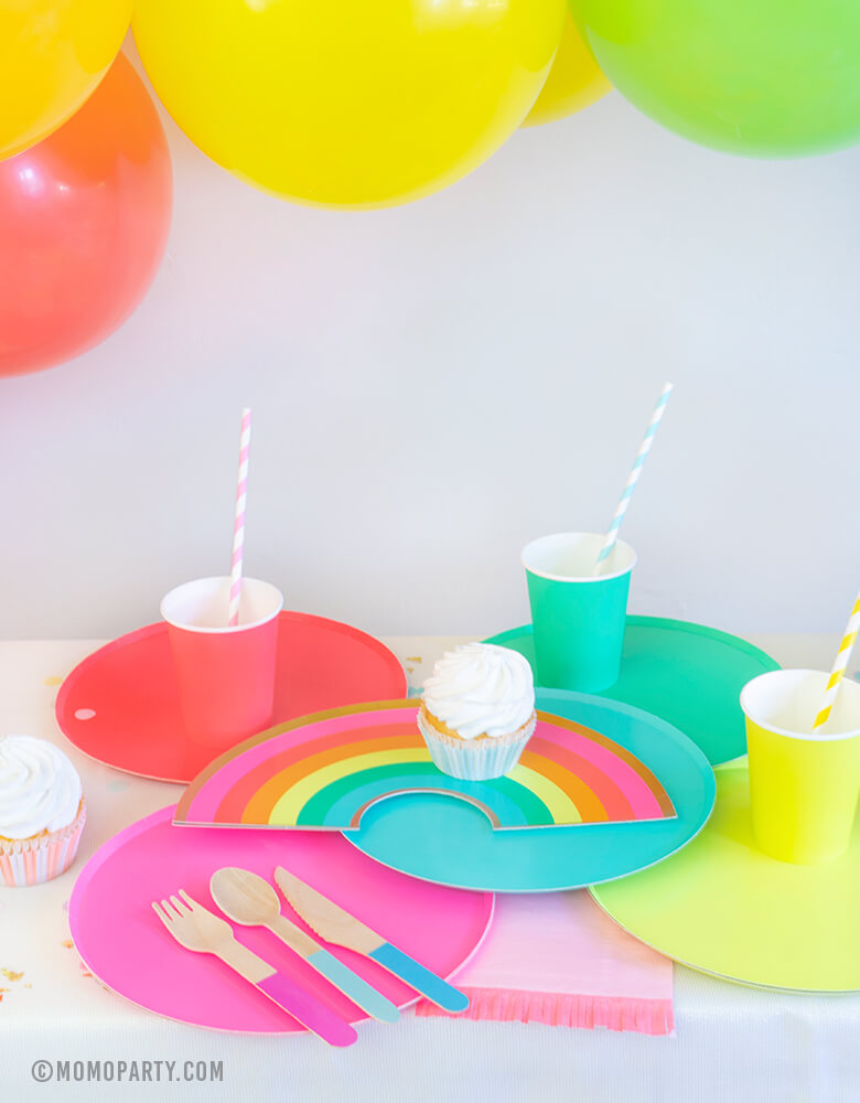 Modern Rainbow Party Dessert table look with Oh happy day Rainbow Plates, colorful Rainbow Large Plate Set, Rainbow Cup Set, cupcakes, Hyper Tropical Wooden Cutlery Set, colorful ballon garland for rainbow themed birthday party, pride party, unicorn party
