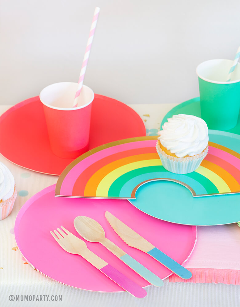 Modern Rainbow Party Dessert table with Oh happy day Rainbow Plates, colorful Rainbow Large Plate Set, Rainbow Cup Set, cupcakes, Hyper Tropical Wooden Cutlery Set, Hip Hip Hooray Fringe Small Napkins for rainbow themed birthday party, pride party, unicorn party