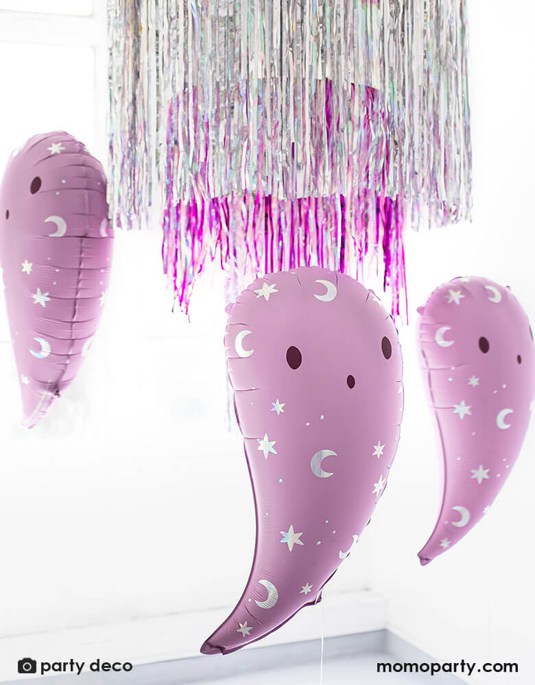 Party Deco 14 inches pink ghost foil balloons featuring iridescent moon and star icons with fringe silver and pink party garlands in the back, perfect for a not-so-scary kid-friendly pink Halloween party