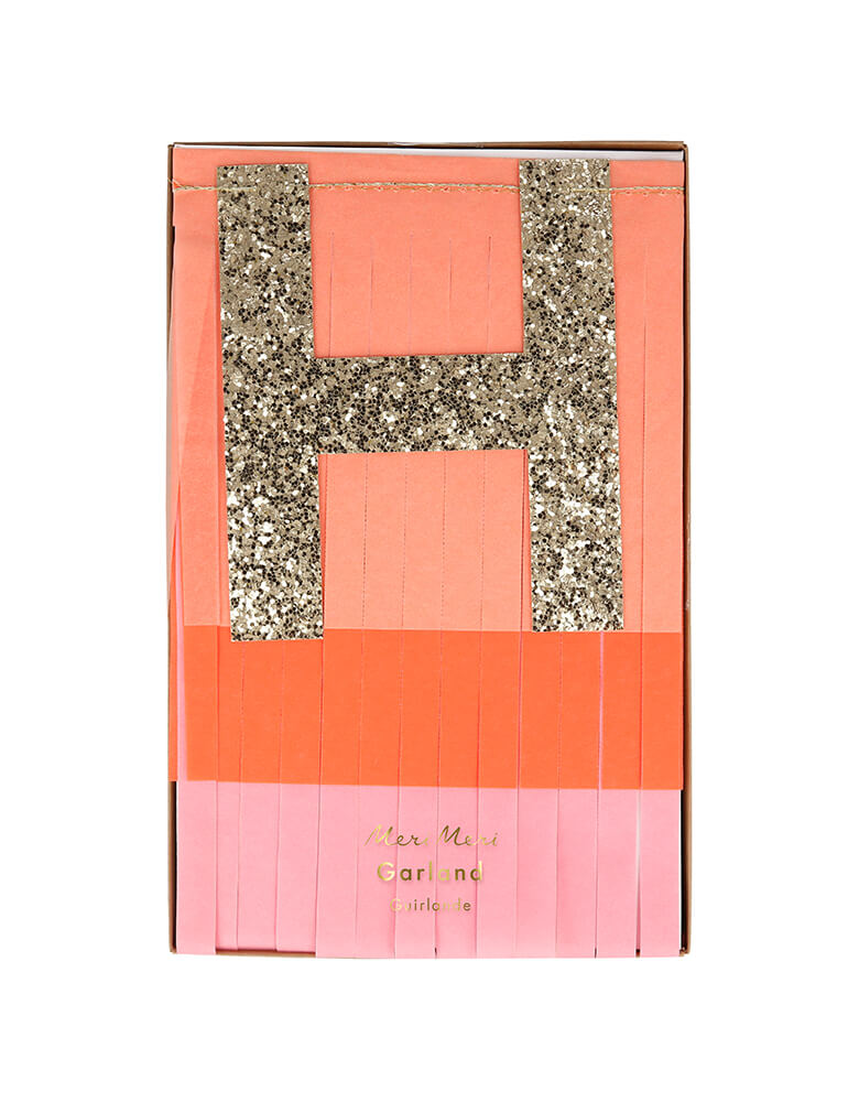 Meri Meri Pink Happy Birthday Fringe Garland. 8ft long in a Packaging made using eco-friendly paper. There are two layers of tissue paper are folded together before being cut into fringing ,The fringed pennants are made of pink, peach and coral tissue paper, The glittered letters are pre-threaded onto cord, and the fringing is stitched together with peach satin ribbons.