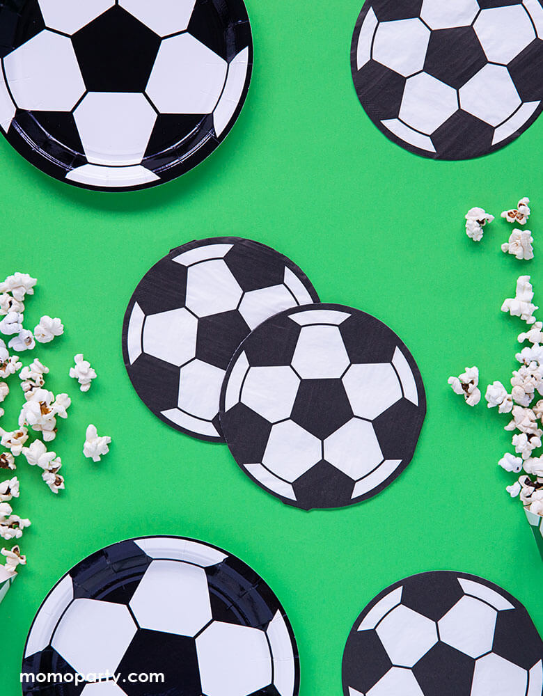Party deco's soccer ball napkins and plates on a Green Party table for a soccer themed birthday party