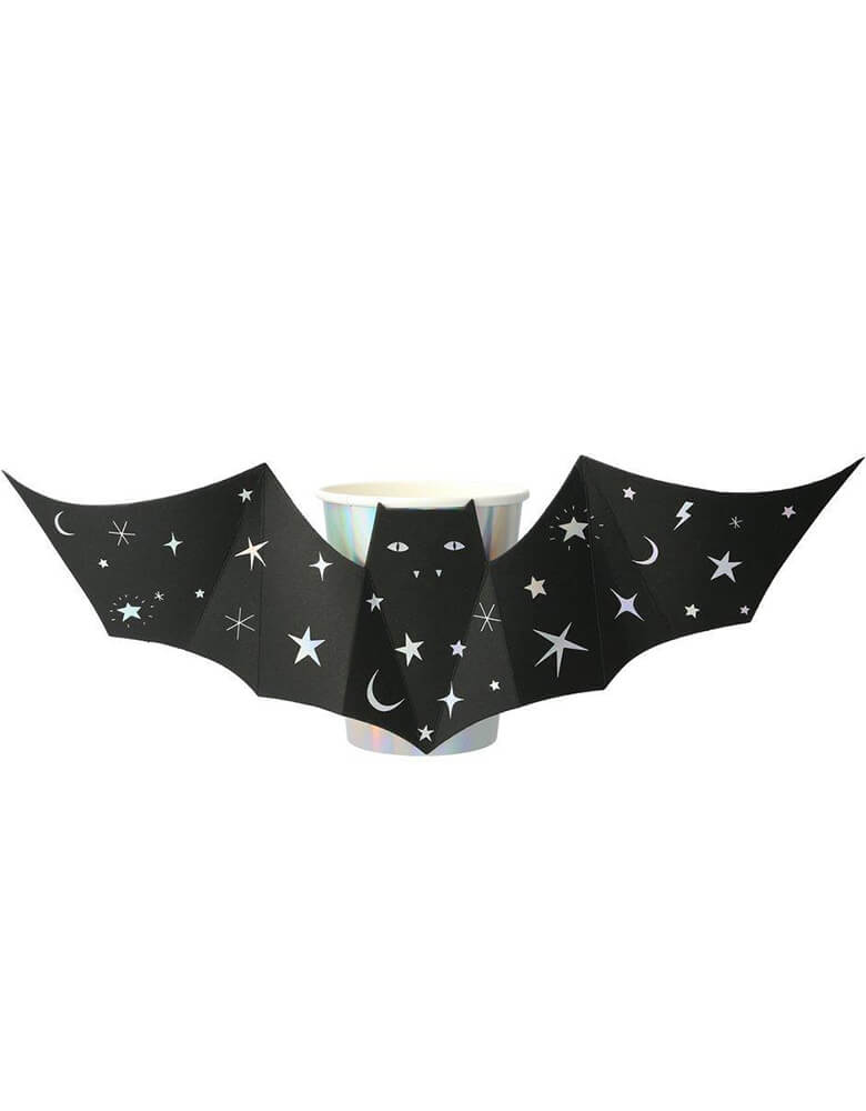 Meri Meri - Sparkle Bat Cups. Set of 8 in 9 oz. These shiny silver holographic cups, featuring black bats with outstretched wings, will thrill and chill your party guests! They are beautifully decorated with shimmering silver stars and moons, and will look amazing on the party table too.