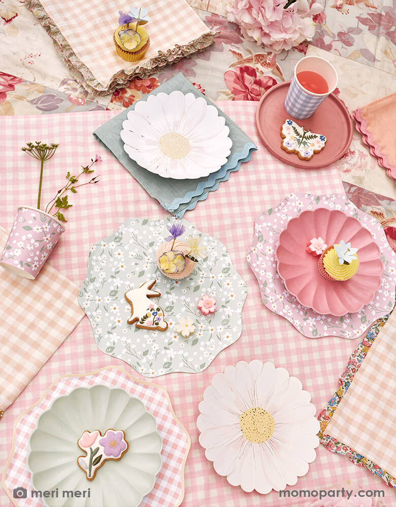 A spring picnic idea with cute flower and bunny cookies, cupcakes on the Meri Meri Ditsy Floral Dinner Plates,  Wild Daisy Plates, Multicolor Simply Eco Plates, Ditsy Floral Cups with flowers and drinks in the Gingham Cups, they all laid on the Ruffle Edge Fabric Napkins. These high quality, modern designed party supplies are perfect for any floral themed party, picnic, tea party, girls party, baby shower or any kinds of celebration  