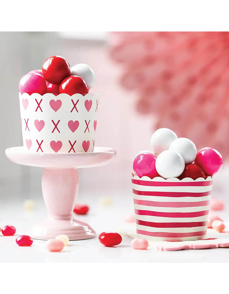Momo Party's 5 oz Pink XOXO and Red Stripes Baking Cups by My Mind's Eye with red, pink and white gumballs.