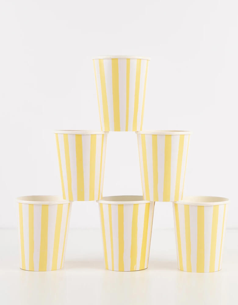 8 of Meri Meri 9oz Yellow white striped cups stacked, they work perfect for any happy celebration or you're my sunshine themed birthday party