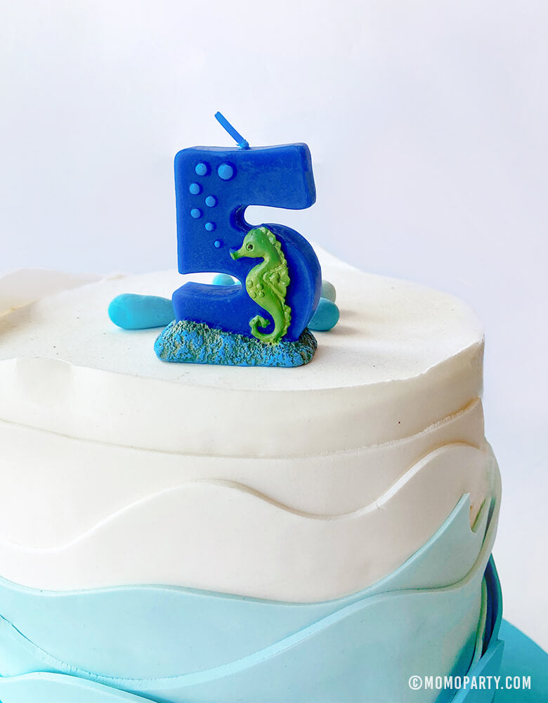 sea themed number candle - number 5 candle on top of sea wave cake. Sea themed birthday party, nautical themed birthday party