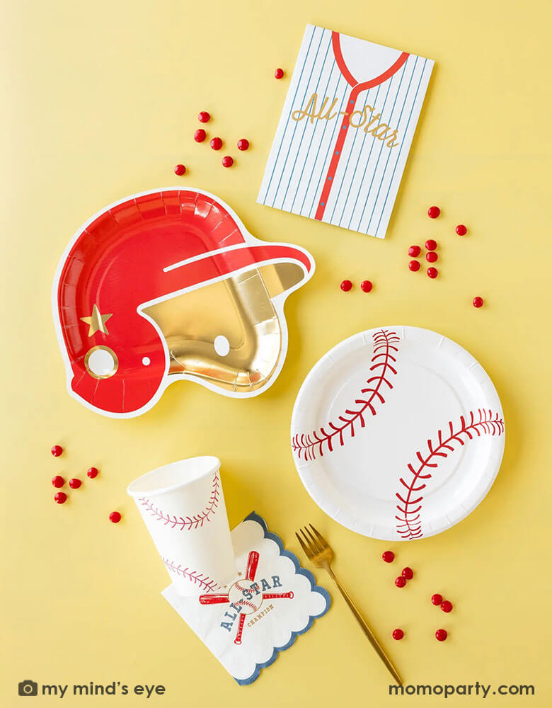 A baseball themed party collection by Momo Party featuring baseball paper tableware by My Mind's Eye, including baseball shaped plates, baseball red helmet shaped plates, baseball all star small napkins, baseball treat bags and baseball party cups, along with some red candies around these partyware, this makes a great inspiration for kid's baseball themed birthday party decoration ideas.