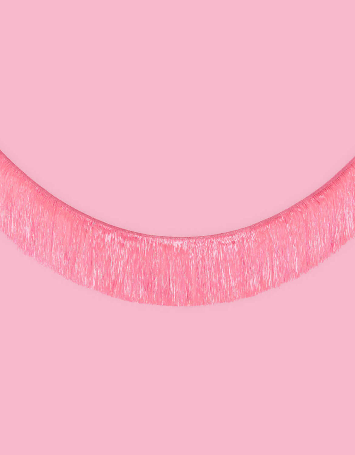 Momo Party's 5 ft Bright Pink Fringe Tinsel Garland on a pink background.