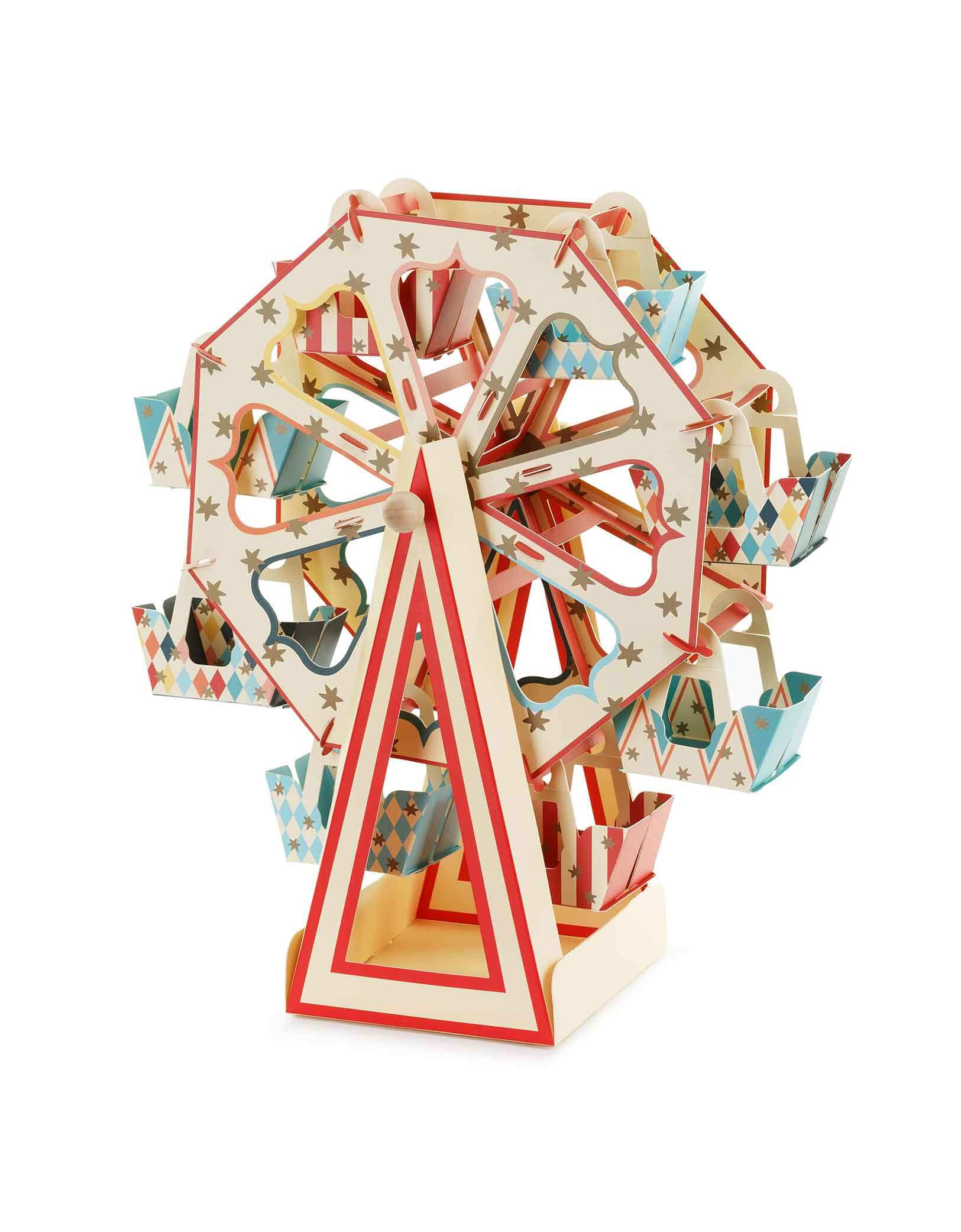 Momo Party's 18.9" x 19.7" Carnival Ferris Wheel Snack Stand by Party Deco. This stunning centerpiece will wow your guests with its circus-inspired design. Fill it with festive cupcakes for a fun and delicious treat. The perfect addition to any carnival themed party!