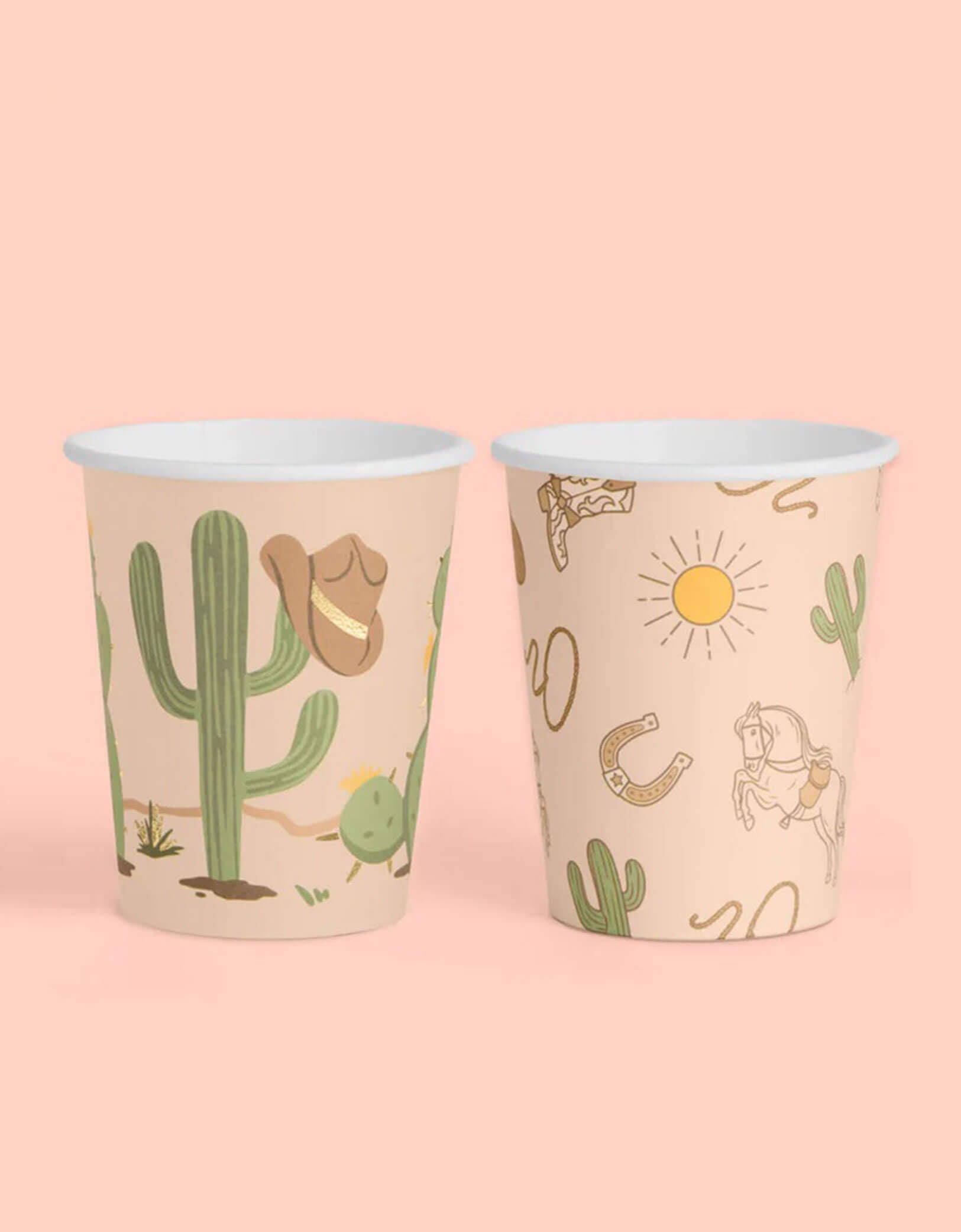 Two Momo Party's Wild Wild West Party Cups  with Western desert-themed designs including cactus, cowboy hat, horseshoe and cowboy boots on a pink background.