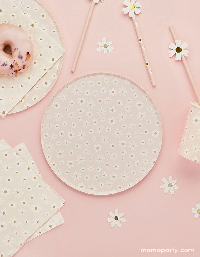 A pale pink table features Momo Party's daisy flower collection including daisy flower round plates, large napkins, daisy flower paper straws and daisy shaped paper confetti by Hooty Balloo - a perfect addition to your spring inspired celebration including Easter parties or Mother's Day celebration.