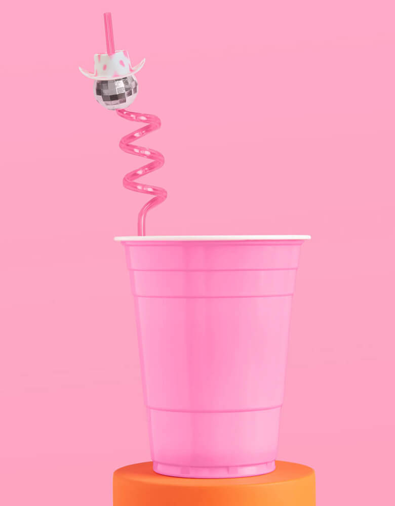Momo Party's 10" reusable disco cowgirl swirly straw by Xo, fetti in a pink solo cup. This disco cowgirl straw with a cowgirl hat on it is perfect for rodeo themed birthday parties or bachelorette parties. Yeehaw!