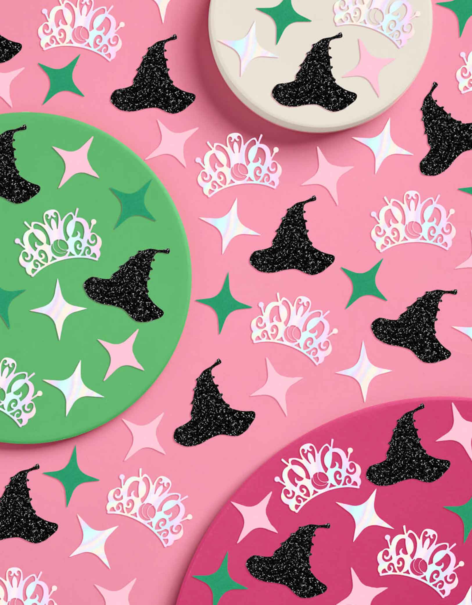 Momo Party's Wicked Witch Confetti featuring witch hats, tiaras, and stars on a pink background. This playful mix features tiny witch hats, sparkling tiaras, and bursts of pink and green confetti, perfect for casting a fun, wickedly charming spell over any party. Sprinkle it on tables or toss it in the air to enchant your guests with a festive, colorful vibe. Perfect for kid's Wicked birthday party, Halloween witch themed bash or a magical gathering.