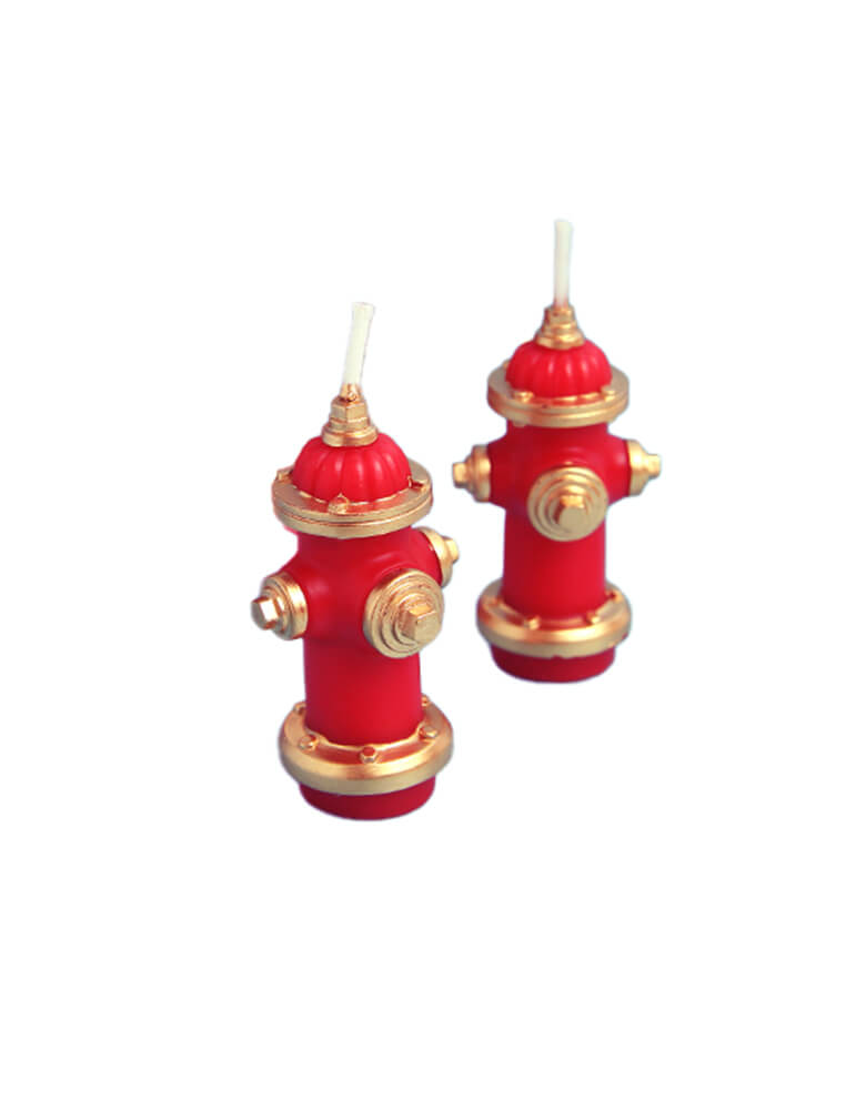 Momo Party's Fire Hydrant Candle Set, feathering Two red fire hydrant-shaped candles with gold accents on a white background. This cute fire hydrant set is a great addition to your kid's fire truck, fire station or firefighter themed party 