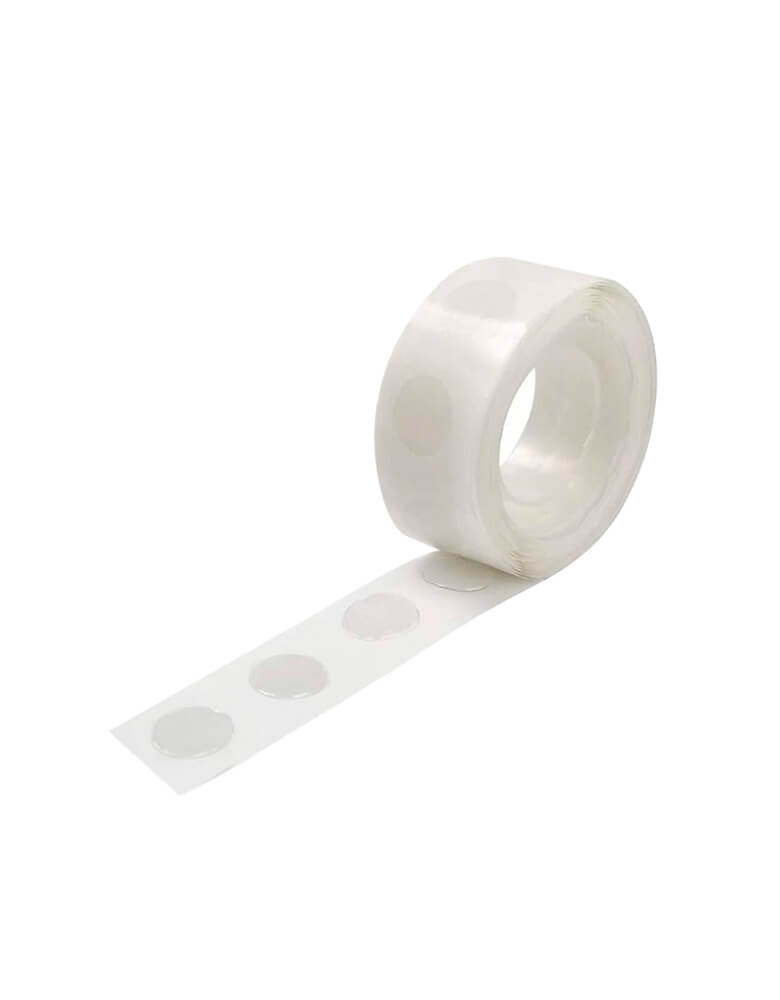 A roll of Glue Dots by Momo Party. Elevate your balloon garland with these glue dots. They're perfect for attaching foil balloons to your balloon garland.