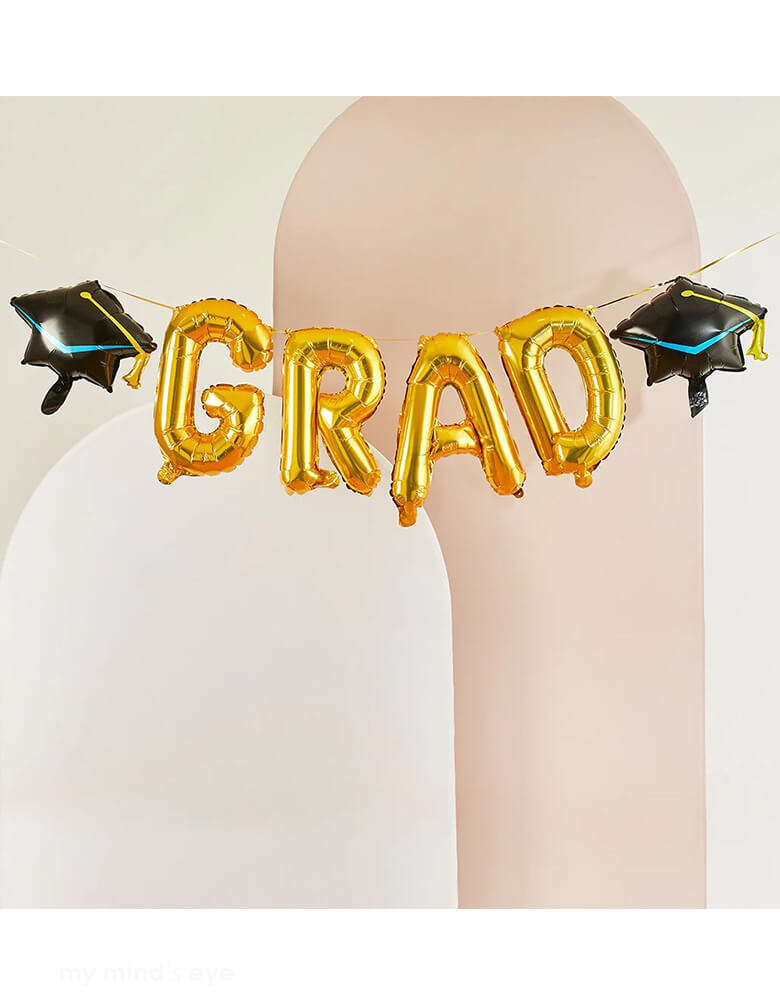 Momo Party's Gold Grad with Graduation Hats Foil Balloon Garland by Hooty Balloo. This balloon garland can transform your party into a gorgeously decorated celebration for any new grad! The kit i</span>ncludes a straw and attach them to a string to make a celebratory banner or tape them to the wall or backdrop.
