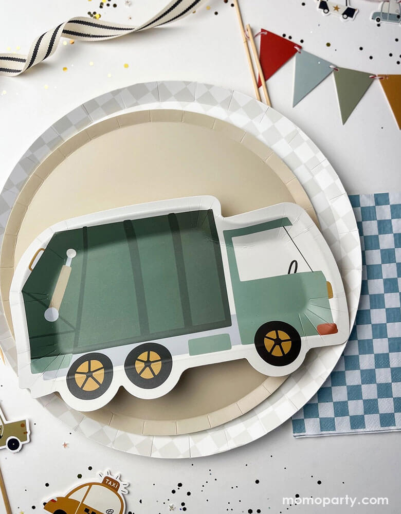 A festive kid's construction themed party tablescape featuring Momo Party's 10.25" light grey checkered dinner plate, 9" beige large plate and a green garbage truck shaped paper plate by Josi James. Around the party plates are blue checkered paper napkins, birthday cake pennant flag topper, and vehicle themed cupcake toppers, along with some confetti, this makes a great inspiration for a preschool boy's birthday party decoration!