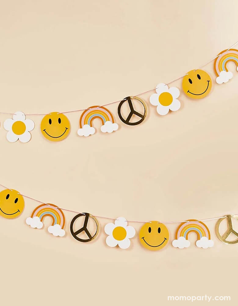 Momo Party's 8' Groovy Gold Foiled Garland by Hooty Balloo. Featuring daisis, smiley faces, rainbows and peace signs, this garland is perfect to set a scene for a retro hippie inspired celebration, be it a "Groovy One" first birthday party or a "Two Groovy" second birthday party.