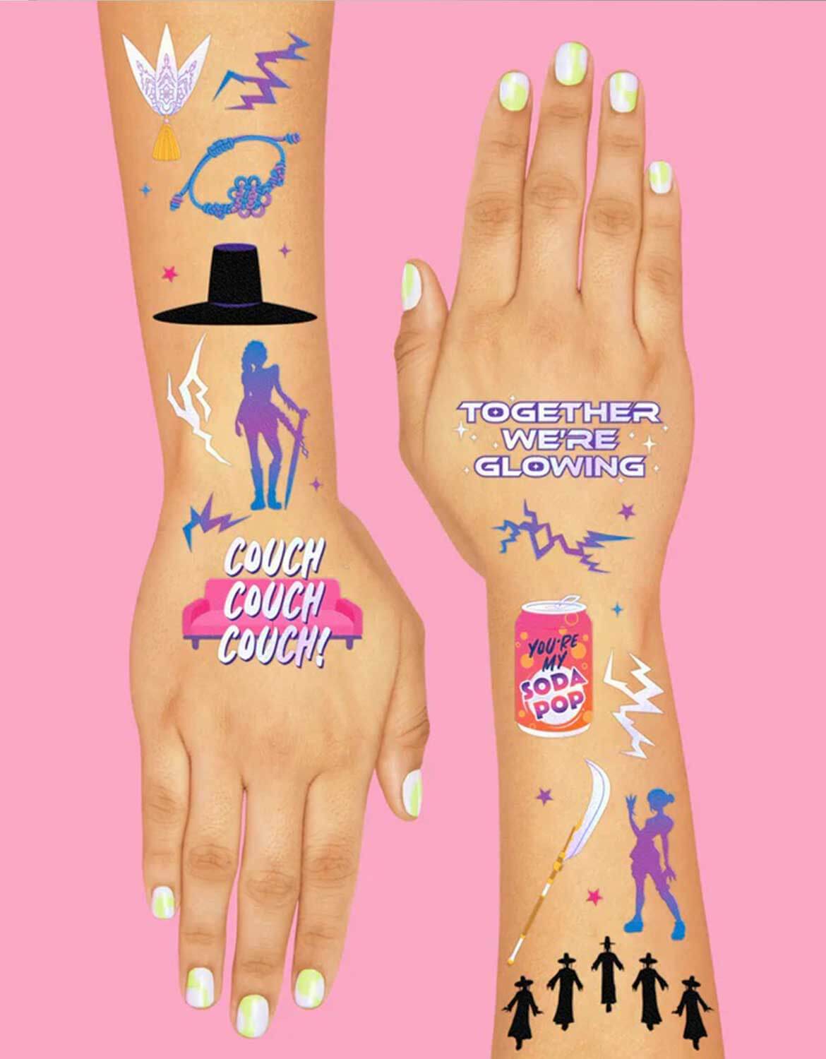Momo Party's Kpop Demon Hunters themed temporary tattoo designs including dancing figures, soda pop cans on person's arm with text and graphics against a pink background.