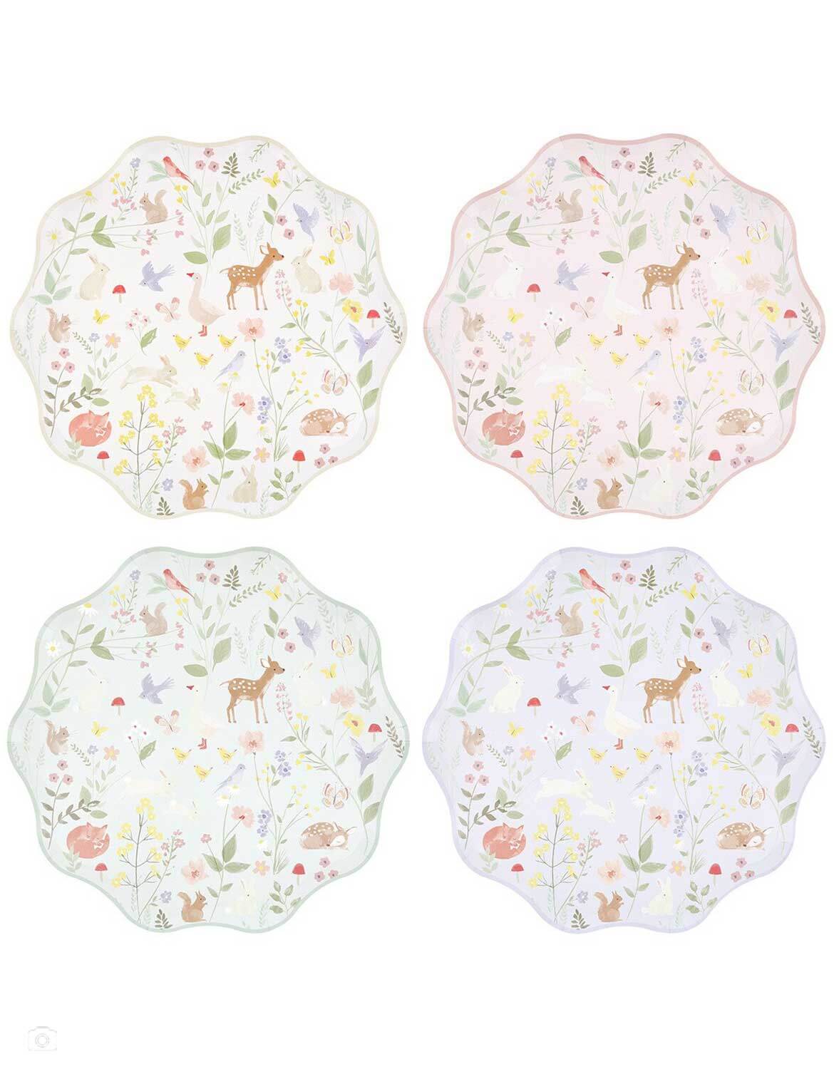 Momo Party's set of four 10.5" cottage inspired dinner plates with forest little animal and floral illustrations on them in pastel pink, mint and blue and off white by Meri Meri on a white background.