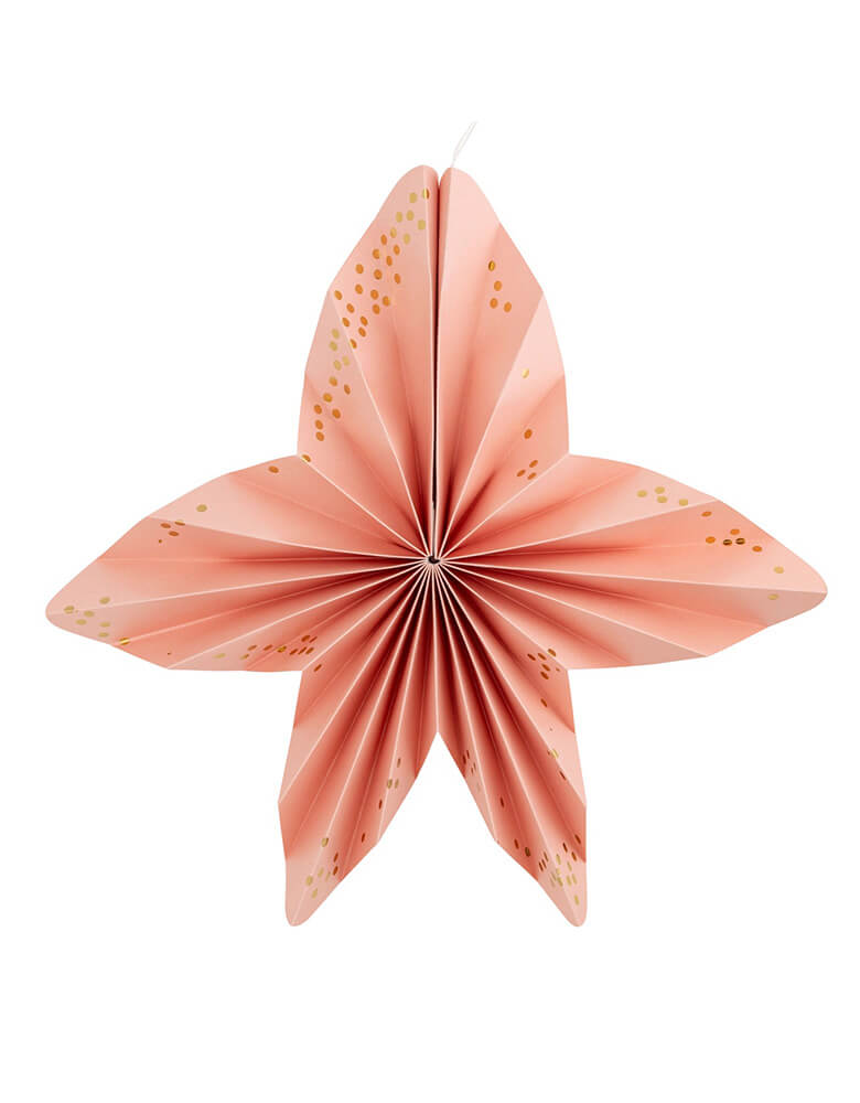 A close up shot of the peach seastar shaped shaped paper fan from Momo Party's Under the Sea Fan Set by My Mind's Eye. Comes in a set of 6 paper fans 6 fans of size 14", 8.5", 8", 7", and 5.5" in pastel colors of aqua, pink, lilac, teal, cream and peach, this mermaid-inspired fan set will add an enchanting touch to any under the sea themed celebration. Bring the ocean to your event and create a memorable atmosphere.