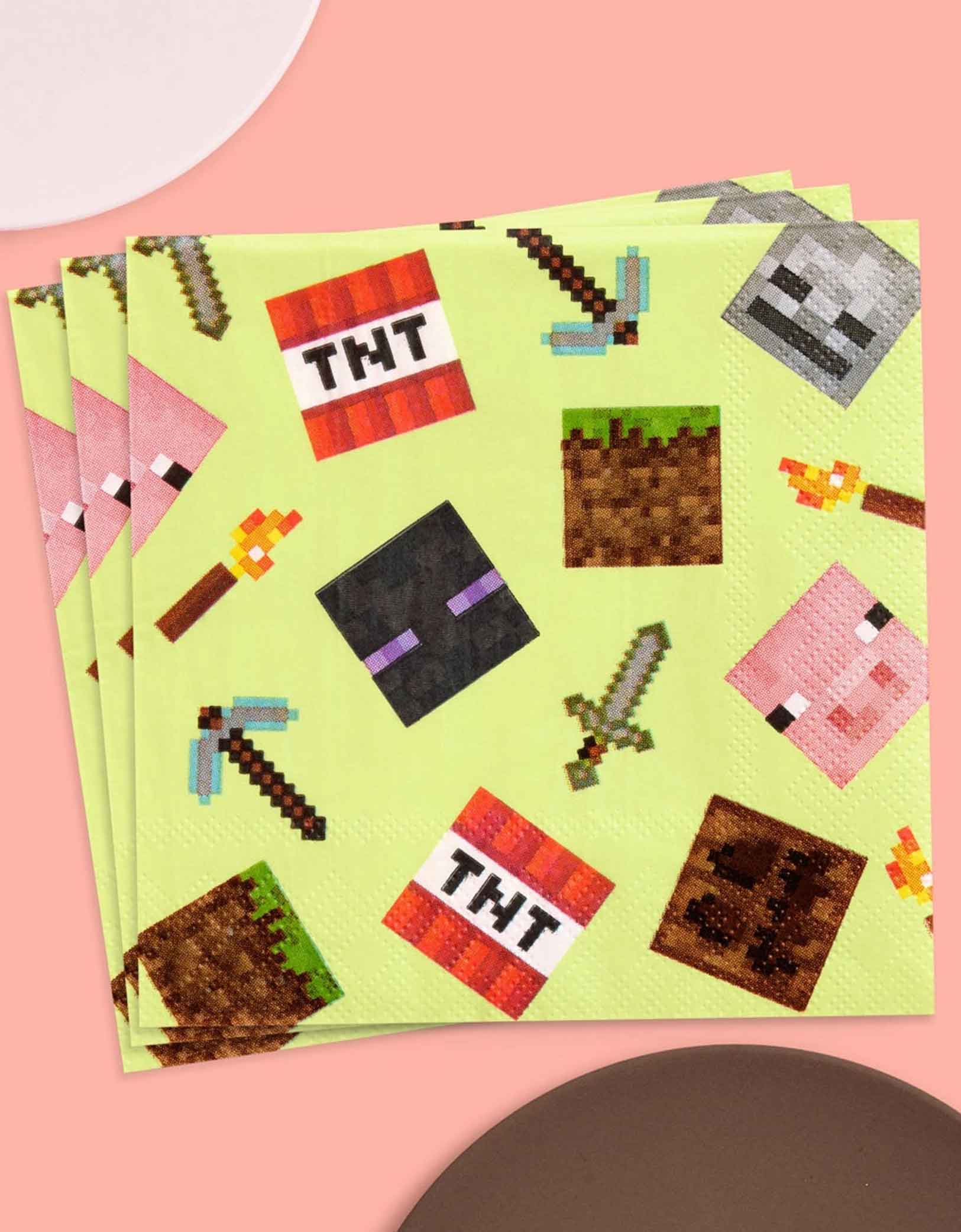 A stack of Momo Party's 5" x 5" Minecraft-themed decorative paper napkins with pixelated icons on a pink background.