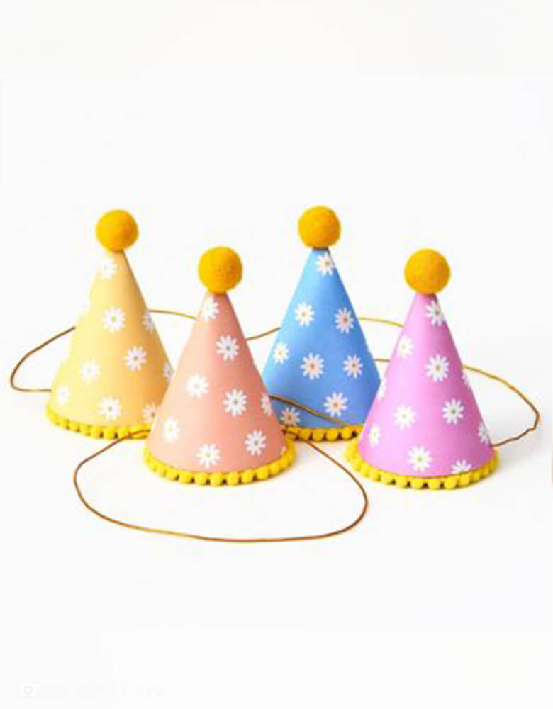 Momo Party's retro daisy party hats by Paper Source. Each one with daisy patten and colorful, so you can show off your good vibes in true '60s style! Get your flower power on and make sure your shindig is truly groovy!