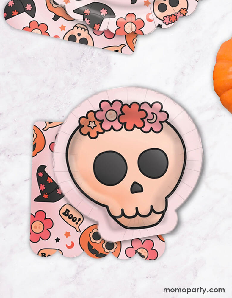 Momo Party's 7" Groovy Halloween Skull Shaped Plates and Groovy Halloween Icon Napkins by Ellie's Party. These floral skull shaped plates are perfect for Halloween. Your guests will absolutely love these plates. Pair these chic skull-shaped dessert plates with groovy halloween icon napkins for a cute and stylish table setting. Featuring groovy pumpkins, skulls, flowers, and witch hats, these napkins and skulls are perfect for your next halloween or fall birthday party!