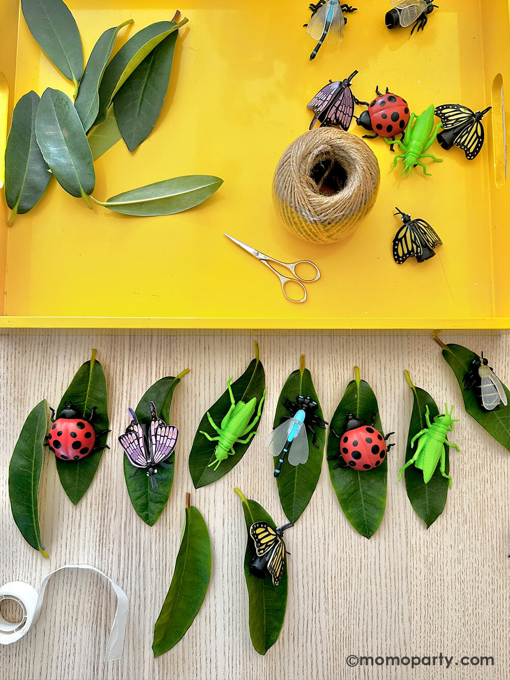 A diy project using Momo Party's various insect finger puppets and real leaves as decoration to party favor bags for kid's bug insect themed birthday party.