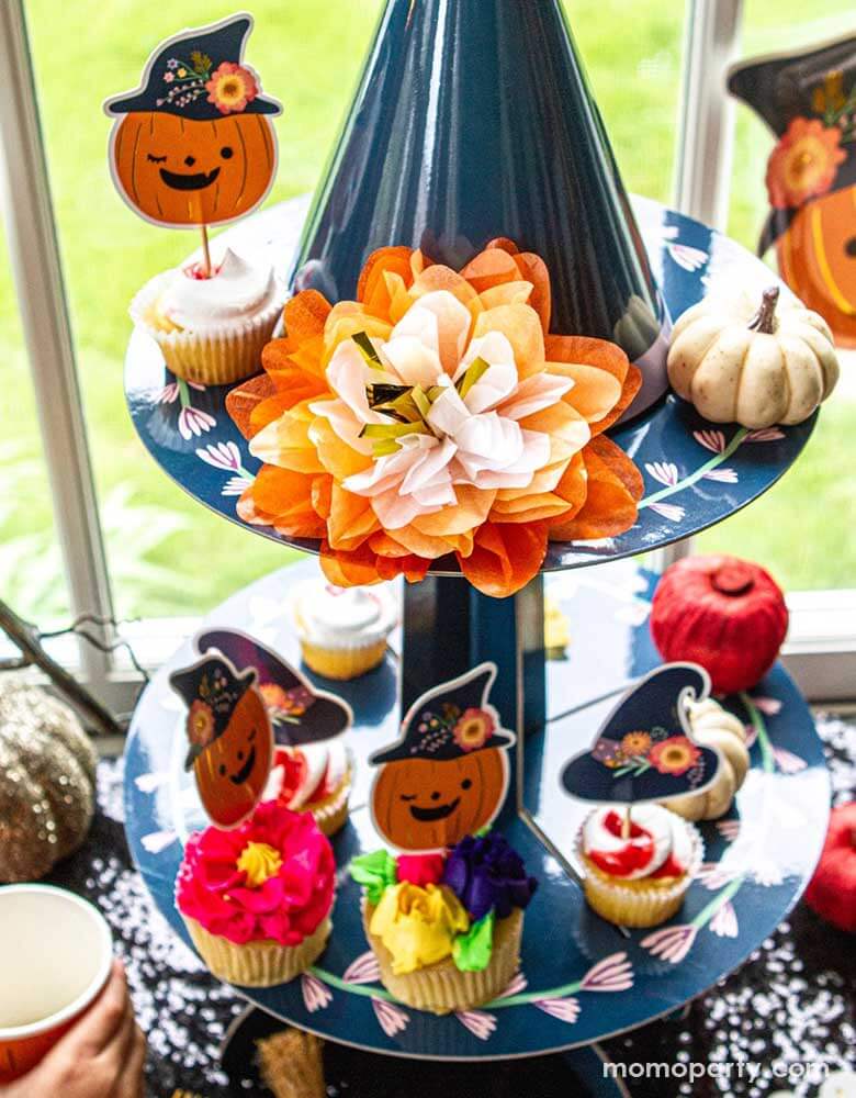 Momo Party's Witch Hat Cupcake Stand by Ma Fete. Featuring a fabulous witch's hat tip for a spooky centerpiece that showcases your halloween cupcake creations. Finished with a beautiful tissue paper flower as part of our floral halloween collection, your cupcakes wouldn’t be complete without this eye-catching stand!