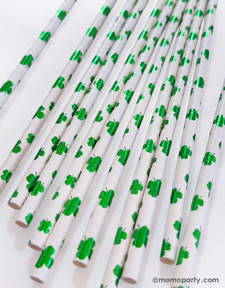 Close up of Momo Party's set of eco friendly disposable paper party straws with St. Patrick's Day foil green shamrock/clover pattern on a white background.