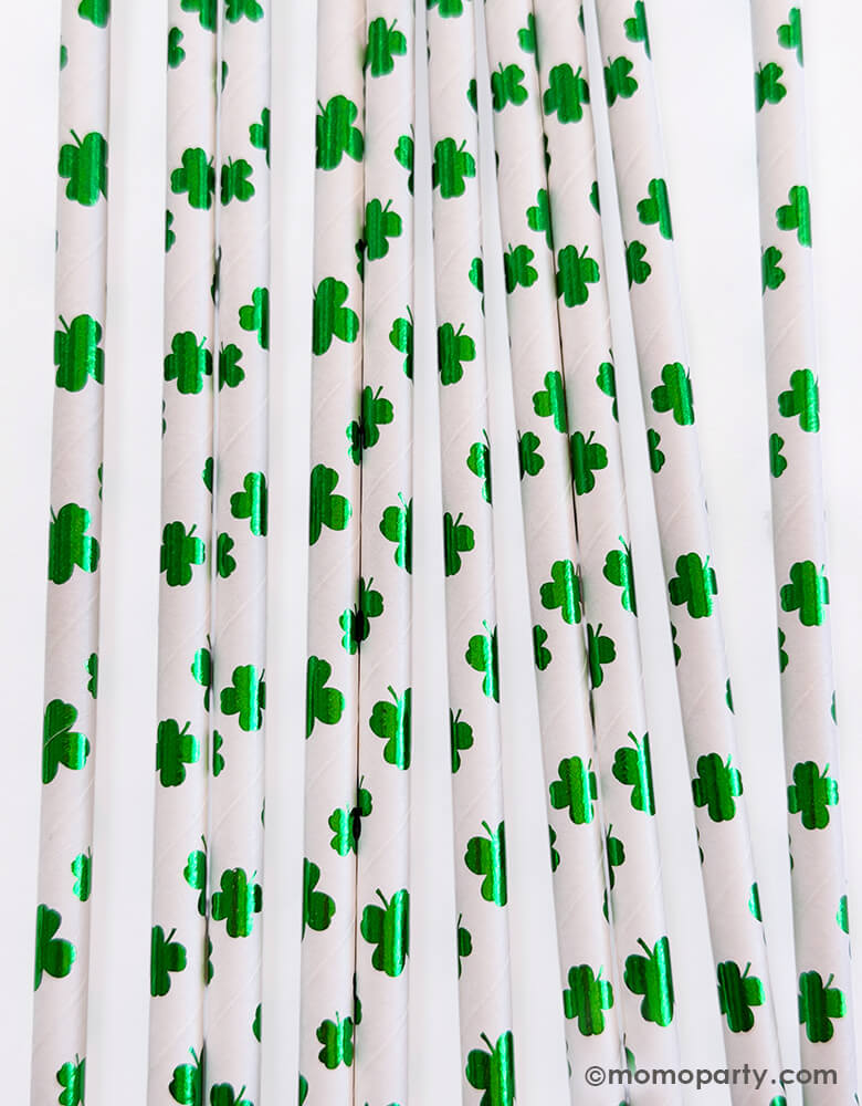 Details of Momo Party's set of eco friendly disposable paper party straws with St. Patrick's Day foil green shamrock/clover pattern on a white background.